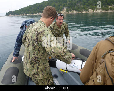 151205-N-XX888-003 SPLIT, Croatia (Dec. 5, 2015) Explosive Ordnance Disposal Technician 2nd Class Matt Volar, left, and Explosive Ordnance Disposal Technician 2nd Class Dan Salman, assigned to Explosive Ordnance Disposal Mobile Unit 8, and Croatian divers recover the IVER-3 UUV Dec. 5, 2015. U.S. 6th Fleet, headquartered in Naples, Italy, conducts the full spectrum of joint and naval operations, often in concert with allied, joint, and interagency partners, in order to advance U.S. national interests and security and stability in Europe and Africa. (U.S. Navy photo by Lt. Jonathan Dobbins/ Rel Stock Photo