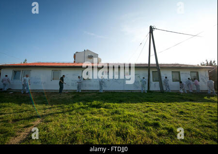 151207-N-ZN152-101 RUSILICA, CROATIA (Dec. 7, 2015) Sailors assigned to aircraft carrier USS Harry S. Truman (CVN 75) remove graffiti from the Juraj Bonaci School for children with special needs during a community relations project. Harry S. Truman Carrier Strike Group is conducting naval operations in the U.S. 6th Fleet area of operations in support of U.S. national security interests in Europe and Africa. (U.S. Navy photo by Mass Communication Specialist 1st Class E.R. Scott/Released) Stock Photo