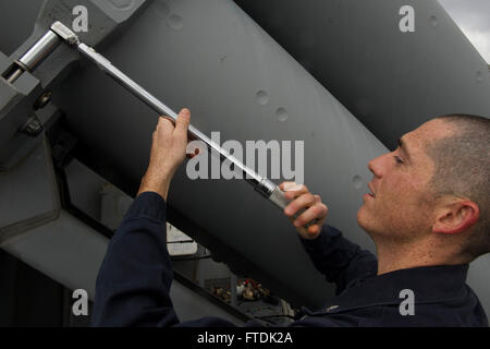 Fire Controlman 2nd Class Michael Goodspeed performs maintenance on the RGM 84D Harpoon Missile aboard USS Carney (DDG 64), an Arleigh Burke-class destroyer, during a routine patrol in the Mediterranean Sea, supporting U.S. national security operations. Stock Photo