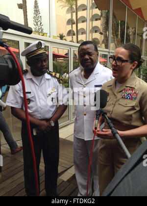 160122-N-RU135-001 DOUALA, Cameroon (Jan. 22, 2016) Commodore, Military Sealift Command Europe and Africa / Commander, Task Force 63, Capt. Heidi Agle, speaks at a press conference along with Cameroonian military representatives Jan. 22, 2016. Agle was on hand to discuss the upcoming Exercise Obangame Express 2016, part of the international collaborative capacity-building program Africa Partnership Station.  U.S. 6th Fleet, headquartered in Naples, Italy, conducts the full spectrum of joint and naval operations, often in concert with allied, joint, and interagency partners, in order to advance Stock Photo