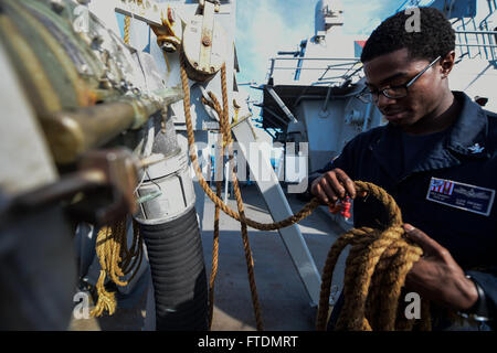 160227-N-FP878-003 MEDITERRANEAN SEA (Feb. 27, 2016) Boatswain’s Mate 3rd Class from Newark, New Jersey, prepares a refueling station for a replenishment-at-sea aboard USS Carney (DDG 64) Feb. 27, 2016. Carney, an Arleigh Burke-class guided-missile destroyer, forward deployed to Rota, Spain, is conducting a routine patrol in the U. S. 6th Fleet area of operations in support of U.S. national security interests in Europe. (U.S. Navy photo by Mass Communication Specialist 1st Class Theron J. Godbold/Released) Stock Photo