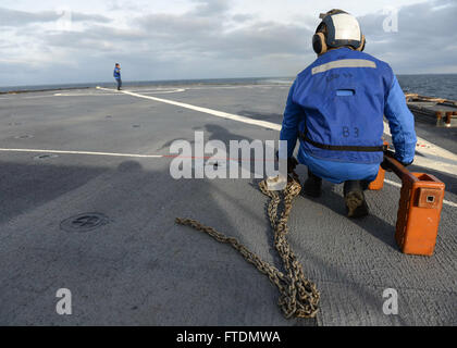 160229-N-QJ850-309 NORTH SEA (Feb. 29, 2016) Seaman Charles Lenoir of Baton Rouge, La. prepares for a vertical replenishment (VERTREP) aboard the Whidbey Island-class dock landing ship USS Fort McHenry (LSD 43) in Trondheim, Norway. Fort McHenry is participating in Exercise Cold Response 2016, a Norwegian invitational, NATO Military Training and Exercise Program (MTEP), Article 4 live exercise with invitations to all NATO and select Partnership for Peace nations that will involve approximately 16,000 troops from 12 countries. (U.S. Navy photo by Mass Communication Specialist 3rd Class Andrew M Stock Photo