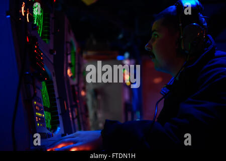 160303-N-FP878-042 MEDITERRANEAN SEA (March 3, 2016) Sonar Technician (Surface) 1st Class Kevin Crawford, from Marana, Arizona, stands sonar control watch aboard USS Carney (DDG 64) March 3, 2016. Carney, an Arleigh Burke-class guided-missile destroyer, forward deployed to Rota, Spain, is conducting a routine patrol in the U. S. 6th Fleet area of operations in support of U.S. national security interests in Europe. (U.S. Navy photo by Mass Communication Specialist 1st Class Theron J. Godbold/Released) Stock Photo