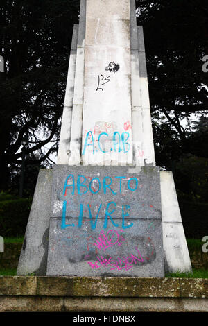 Aborto livre / free abortion protest graffiti on base of Cruz de los Caidos monument to those who died in the Spanish Civil War, Vigo, Galicia, Spain Stock Photo