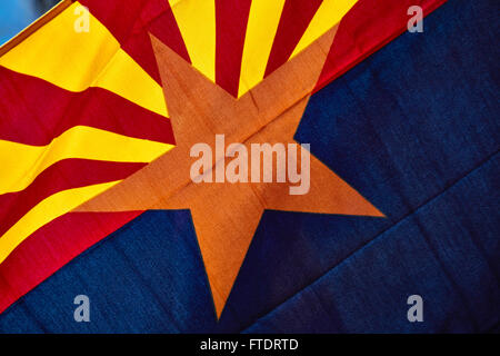 arizona state flag stars and stripes POW/MIA flag flying at half mast ...