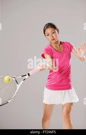 Young Japanese tennis player in action Stock Photo