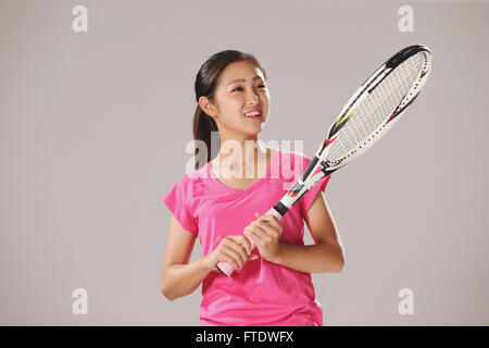 Young Japanese tennis player in action Stock Photo