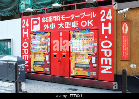 A 24-hour vending machine selling soft drinks on a street in Osaka, Japan. Stock Photo