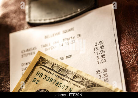 Cafe paper cheque with dollars in closeup Stock Photo