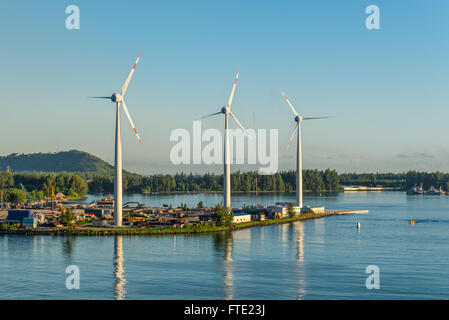 Wind turbines producing clean electricity at dawn in Victoria, Mahe Island, Seychelles Stock Photo