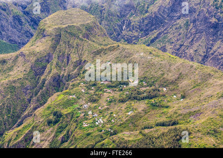 Village in the mountains of the Mafate Cirque Reunion Island. The Mafate cirque can only be entered by helicopter or on foot. Stock Photo