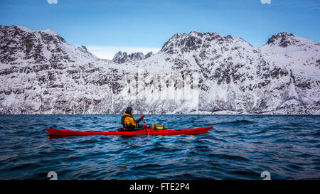 Winter kayaking in Ersfjord, Kvaloya near Tromso Northern Norway Stock Photo