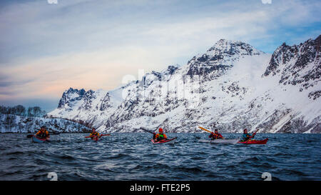 Winter kayaking in Ersfjord, Kvaloya near Tromso Northern Norway Stock Photo