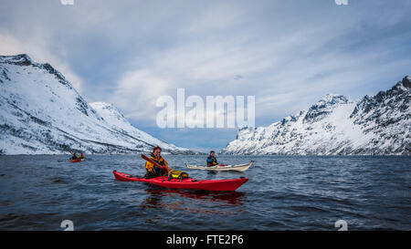 Winter kayaking in Ersfjord, Kvaloya near Tromso Northern Norway Stock Photo