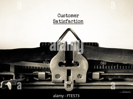 Customers satisfaction and customer service motto on a vintage typewriter Stock Photo