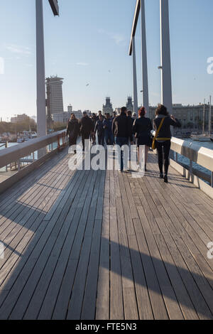 Tourists on bridge at Port Vell, Barcelona, Catalonia, Spain, Europe Stock Photo