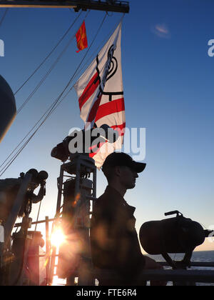 160128-N-XO000-010 MEDITERRANEAN SEA (Jan. 28, 2016) Ensign John Denz from Buffalo, New York, watches as USS Carney (DDG 64) conducts a passing exercise with the German oiler Bonn (AFSH-1413) during an impromptu passing exercise Jan. 28, 2016. Carney, an Arleigh Burke-class guided-missile destroyer, forward deployed to Rota, Spain, is conducting a routine patrol in the U. S. 6th Fleet area of operations in support of U.S. national security interests in Europe. (U.S. Navy photo by Commander P. F. Halvorsen/Released) Stock Photo