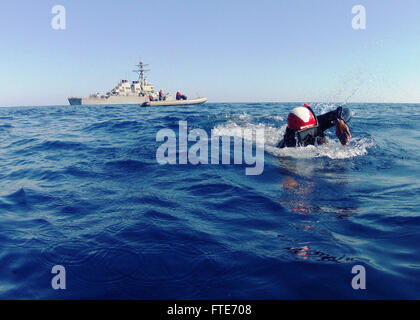 140322-N-CH661-021 MEDITERRANEAN SEA (March 22, 2014) - Seaman Joshua Edwards, assigned to the guided-missile destroyer USS Ramage (DDG 61), conducts search and rescue swimmer duties during a simulated rescue. Ramage, homeported in Norfolk, Va., is on a scheduled deployment supporting maritime security operations and theater security cooperation efforts in the U.S. 6th Fleet area of operations. (U.S. Navy photo by Mass Communication Specialist 2nd Class Jared King/Released)   Join the conversation on Twitter ( https://twitter.com/naveur navaf )  follow us on Facebook ( https://www.facebook.com Stock Photo