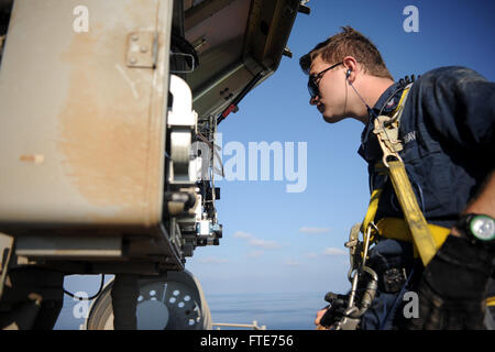 Fire Controlman 3rd Class Trevor Izard performs maintenance on radar equipment aboard the aircraft carrier USS Nimitz (CVN 68) while deployed in the Mediterranean Sea, supporting maritime security and theater security cooperation operations. Stock Photo