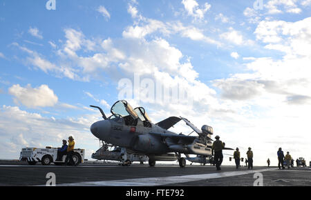 TYRRHENIAN SEA (Nov. 4, 2013) Sailors move an EA-6B Prowler assigned to the “Gray Wolves” of Electronic Attack Squadron (VAQ) 142 on the flight deck of the aircraft carrier USS Nimitz (CVN 68). Nimitz is deployed supporting maritime security operations and theater security cooperation efforts in the U.S. 6th Fleet area of operations. (U.S. Navy photo by Mass Communication Specialist Seaman Eric M. Butler/ Released) Stock Photo
