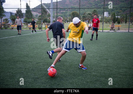 AKSAZ, Turkey (Nov. 11, 2013) - Operations Specialist 2nd Class Oscar Valdez, assigned to the Arleigh Burke-class guided-missile destroyer USS Stout (DDG 55), steels a pass from a sailor assigned to the Turkish frigate TCG Giresun (F 491), during a soccer match while inport on Aksaz Naval Base, to support Exercise Dogu Akdeniz 2013. The exercise was hosted by Commander, Turkish Fleet to support interoperability efforts. Stout, homeported in Norfolk, Va., is on a scheduled deployment supporting maritime security operations and theater security cooperation efforts in the U.S. 6th Fleet area of o Stock Photo