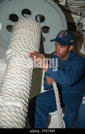 Aksaz, Turkey (Nov. 12, 2013) - Seaman Apprentice Trevor Ellam secures mooring line on a reel aboard the Arleigh Burke-class guided-missile destroyer USS Stout (DDG 55) while departing Aksaz Naval Base, to support Exercise Dogu Akdeniz 2013. The exercise was hosted by Commander, Turkish Fleet to support interoperability efforts. Stout, homeported in Norfolk, Va., is on a scheduled deployment supporting maritime security operations and theater security cooperation efforts in the U.S. 6th Fleet area of operation. (U.S. Navy photo by Mass Communication Specialist 2nd Class Amanda R. Gray/Released Stock Photo