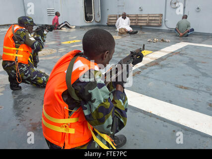 DJIBOUTI, Djibouti (Nov. 14, 2013) - Uganda People's Defence Force members guard simulated detainees on a vessel during Exercise Cutlass Express 2013 in the Gulf of Tadjoura near Djibouti. Exercise Cutlass Express 2013 is a multinational maritime exercise in the waters off East Africa to improve cooperation, tactical expertise and information sharing practices among East Africa maritime forces to increase maritime safety and security in the region. (U.S. Air Force photo by Staff Sgt. Chad Warren) Stock Photo