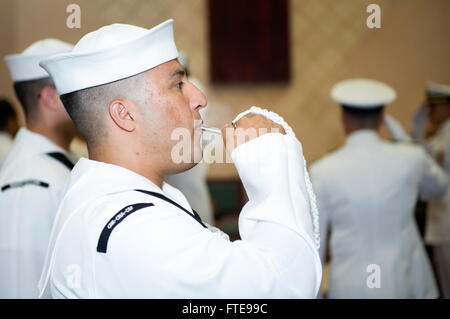 150717-N-YQ852-010 NAPLES, Italy (July 17, 2015) Yeoman 1st Class Alfredo Barros, from Cartagena, Colombia, pipes aboard a distinguished guest during a change of command ceremony for Commander, Task Force 69, Capt. Marc Stern at Naval Support Activity Naples, Italy, July 17, 2015. Capt. Marc Stern turned over command to Capt. Anthony Carullo. . U.S. 6th Fleet, headquartered in Naples, Italy, conducts the full spectrum of joint and naval operations, often in concert with allied, joint, and interagency partners, in order to advance U.S. national interests and security and stability in Europe and Stock Photo