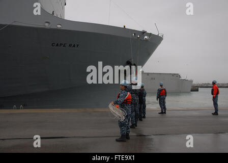 140213-N-UI568-410: ROTA, Spain (Feb. 13, 2014) – Sailors assigned to Naval Station Rota handle lines for the arrival of the container ship MV Cape Ray (T-AKR 9679) for a scheduled port visit. The vessel was modified to contribute to the United Nations and the Organization for the Prohibition of Chemical Weapons joint mission to eliminate Syria's chemical weapons materials. (U.S. Navy photo by Morgan Over/Released) Join the conversation on Twitter ( https://twitter.com/naveur navaf )  follow us on Facebook ( https://www.facebook.com/USNavalForcesEuropeAfrica )  and while you're at it check us  Stock Photo