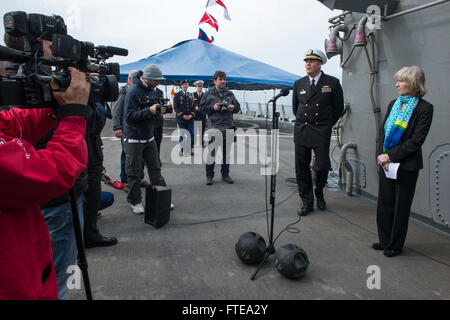 140219-N-UD469-146 SPLIT, Croatia (Feb. 19, 2014) - Cmdr. Robert Alpigini, commanding officer of the Arleigh Burke-class guided-missile destroyer USS Stout (DDG 55), and Deputy Chief of Mission, Maggie Nardi, talk with local media on the flight deck of the ship during a scheduled port visit. Stout, homeported in Norfolk, Va., is on a scheduled deployment supporting maritime security operations and theater security cooperation efforts in the U.S. 6th Fleet area of operation. (U.S. Navy photo by Mass Communication Specialist 2nd Class Amanda R. Gray/Released)  Join the conversation on Twitter (  Stock Photo