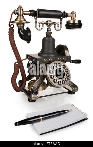 Retro Phone, Pen and Notepad - Vintage Telephone Set isolated on White Background Stock Photo