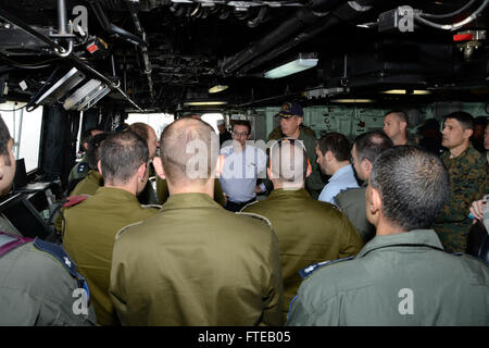 140306-N-HB951-046 MEDITERRANEAN SEA (Mar. 6, 2014) – Capt. Kenneth J. Reynard, commanding officer of amphibious transport dock ship USS Mesa Verde (LPD 19), gives a tour of the bridge to distinguished visitors, including Israeli Air Force Chief of Staff Brig. Gen. Hagi Topolansky and William Grant, deputy chief of mission in Tel Aviv, Israel. Mesa Verde Sailors and Marines assigned to 22nd Marine Expeditionary Unit (MEU) are deployed supporting maritime security operations, providing crisis response capability, increasing theater security cooperation and a forward naval presence in the U.S. 5 Stock Photo