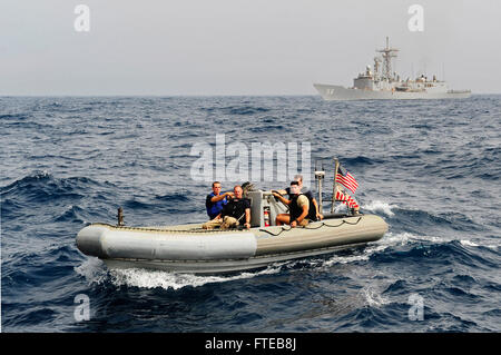 120623-N-GN377-143 ATLANTIC OCEAN (June 23, 2012) Sailors aboard the guided-missile frigate USS SimpsonÕs (FFG 56) rigid hull inflatable boat are alongside a fishing vessel in SenegalÕs Exclusive Economic Zone after dropping off a joint-boarding team of U.S. Coast Guard and Senegalese sailors to inspect a ship. Simpson recently supported African Maritime Law Enforcement Partnership (AMLEP) operations, a branch of the Africa Partnership Station (APS), in an effort to build maritime safety and security on and off shore. (U.S. Navy photo by Mass Communication Specialist 1st Class Daniel Mennuto/R Stock Photo