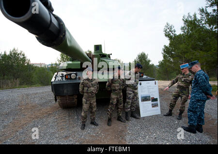 140311-N-WD757-083 MARSEILLE, France (March 11, 2014) – French Army Lt. Humbert Vuatrin, assigned to the Armée De Terre 4e Regiment De Dragons tank regiment, explains the characteristics of a French Army Leclerc main battle tank to Ensign Ian Sundstrom, assigned to the guided-missile destroyer USS Arleigh Burke (DDG 51), while the ship is on a scheduled port visit to Marseille, France. Arleigh Burke is on a scheduled deployment in support of maritime security operations and theater security cooperation efforts in the U.S. 6th Fleet area of operations. (U.S. Navy photo by Mass Communication Spe Stock Photo