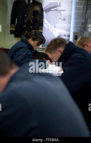 140313-N-WD757-089 MARSEILLE, France (March 13, 2014) – Fire Controlman 3rd Class Gabrielle Hall takes a Navy-wide second-class petty officer advancement exam aboard the guided-missile destroyer USS Arleigh Burke (DDG 51) while the ship is in Marseille for a scheduled visit. Arleigh Burke is on a scheduled deployment in support of maritime security operations and theater security cooperation efforts in the U.S. 6th Fleet area of operations. (U.S. Navy photo by Mass Communication Specialist 2nd Class Carlos M. Vazquez II/Released)  Join the conversation on Twitter ( https://twitter.com/naveur n Stock Photo