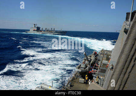 140314-N-CH661-691 MEDITERRANEAN SEA (March 14, 2014) - The guided-missile destroyer USS Ramage (DDG 61) breaks away from the military Sealift Command fleet replenishment oiler USNS John Lenthall (T-AO 189) after conducting an underway replenishment. Ramage, homeported in Norfolk, Va., is on a scheduled deployment supporting maritime security operations and theater security cooperation efforts in the U.S. 6th Fleet area of operations. (U.S. Navy photo by Mass Communication Specialist 2nd Class Jared King/Released)   Join the conversation on Twitter ( https://twitter.com/naveur navaf )  follow  Stock Photo