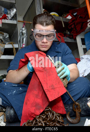 140315-N-CH661-072 MEDITERRANEAN SEA (March 15, 2014) - Boatswain’s Mate Seaman Ethan J. Giannolla, assigned to the guided-missile destroyer USS Ramage (DDG 61), conducts maintenance on a tie-down chain. Ramage, homeported in Norfolk, Va., is on a scheduled deployment supporting maritime security operations and theater security cooperation efforts in the U.S. 6th Fleet area of operations. (U.S. Navy photo by Mass Communication Specialist 2nd Class Jared King/Released)   Join the conversation on Twitter ( https://twitter.com/naveur navaf )  follow us on Facebook ( https://www.facebook.com/USNav Stock Photo