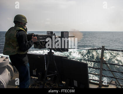 140315-N-KE519-132 MEDITERRANEAN SEA (March 15, 2014) - A Sailor fires a .50 caliber machine gun during a live-fire evolution aboard the forward-deployed Arleigh Burke-class guided-missile destroyer USS Donald Cook (DDG 75). Donald Cook, the first of four Arleigh Burke-class destroyers to be forward-deployed to Rota, is serving on a scheduled patrol to the U.S. 6th Fleet area of operations. (U.S. Navy photo by Mass Communication Specialist Seaman Edward Guttierrez III/RELEASED)  Join the conversation on <a href='https://twitter.com/naveur navaf' rel='nofollow'>Twitter</a> follow us on <a href= Stock Photo