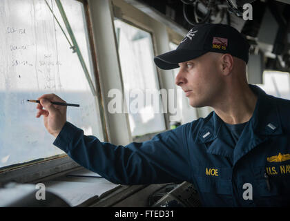 140402-N-KE519-045: MEDITERRANEAN SEA (April 2, 2014) - Lt.j.g. Paul Moe marks navigation points on a bridge window aboard the forward-deployed Arleigh Burke-class guided-missile destroyer USS Donald Cook (DDG 75). Donald Cook, homeported in Rota, Spain, is on a scheduled deployment supporting maritime security operations and theater security cooperation efforts in the U.S. 6th Fleet area of operations.  (U.S. Navy photo by Mass Communication Specialist Seaman Edward Guttierrez III/RELEASED)  Join the conversation on Twitter ( https://twitter.com/naveur navaf )  follow us on Facebook ( https:/ Stock Photo
