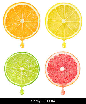Slices of citrus fruits with drop of juice isolated on white with clipping path Stock Photo