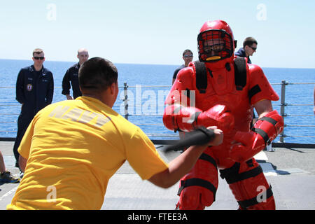 MEDITERRANEAN SEA, (April 11, 2013).- Seaman Perez attacks the “Red Man,” Yeoman 3rd Class Jonathon Meckstroth, during Security Reaction Force-Bravo training aboard USS Robert G. Bradley (FFG 49). Robert G. Bradley is homeported in Mayport, Fla., and is deployed conducting maritime security operations and theater security cooperation efforts in the U.S. 6th Fleet area of responsibility. (US Navy photo by Electronic Technician 1st Class Daniel Raley) Stock Photo