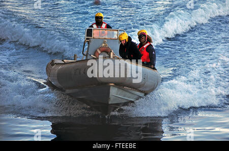 LIGURIAN SEA (April 16, 2013) – Military Sealift Command civil service mariners assigned to the amphibious command ship USS Mount Whitney (LCC 20), ride in a rigid-hull inflatable boat during a man overboard drill. Mount Whitney, homeported in Gaeta, Italy, is the U.S. 6th Fleet flagship and operates with a combined crew of U.S. Sailors and MSC civil service mariners. The civil service mariners perform navigation, deck, engineering and supply service operations, while military personnel aboard support communications, weapons systems and security. (U.S. Navy photo by Mass Communication Speciali Stock Photo