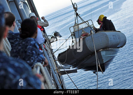 LIGURIAN SEA (April 16, 2013) – Military Sealift Command civil service mariners assigned to the amphibious command ship USS Mount Whitney (LCC 20) recover a rigid-hull inflatable boat following a man overboard drill. Mount Whitney, homeported in Gaeta, Italy, is the U.S. 6th Fleet flagship and operates with a combined crew of U.S. Sailors and MSC civil service mariners. The civil service mariners perform navigation, deck, engineering and supply service operations, while military personnel aboard support communications, weapons systems and security. (U.S. Navy photo by Mass Communication Specia Stock Photo