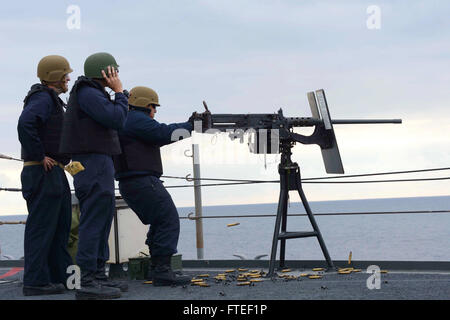 151015-N-VY489-064 IRISH SEA (Oct. 16, 2015) Electronics Technician 2nd Class Keng Von fires a .50-caliber machine gun during a live-fire exercise aboard the U.S.6th Fleet command and control ship USS Mount Whitney (LCC 20). Mount Whitney, forward deployed to Gaeta, Italy, operates with a combined crew of Sailors and Military Sealift Command civil service mariners. (U.S. Navy photo by Mass Communication Specialist 1st Class Mike Wright/ Released) Stock Photo