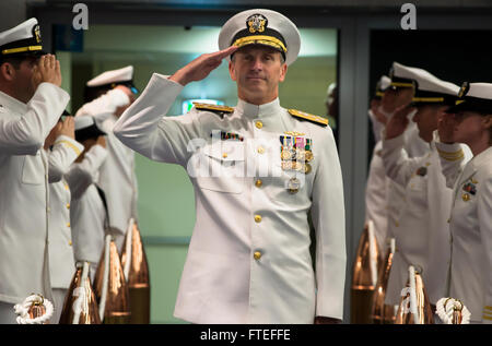 140722-N-FQ994-051 NAPLES, Italy (July 22, 2014) Adm. Jonathan Greenert, U.S. Chief of Naval Operations, renders a salute as he arrives for the Allied Joint Force Command Naples/Commander, U.S. Naval Forces Europe-Africa change of command ceremony where Adm. Mark Ferguson relieved Adm. Bruce Clingan. (U.S. Navy Photo by Mass Communication Specialist 3rd Class Robert S. Price/Released) Stock Photo