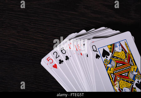 Deck of Playing cards on wooden background. Stock Photo