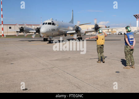 SIGONELLA, Sicily (Oct. 6, 2014) - Aviation Machinists Mate 3rd Class Jason Conyers launches a P-3C Orion maritime patrol aircraft attached to Patrol Squadron FOUR (VP-4). VP-4 is conducting naval operations in the U.S. 6th Fleet area of operations in support of U.S. national security and interests in Europe. Stock Photo