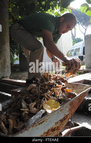 NAPLES, Italy (Oct. 13, 2014) - Staff Sgt. Alejandro Galvez assists in yard work for a local church during community relations project in Naples, Italy. Bataan, homeported in Norfolk, Va., is conducting naval operations in the U.S. 6th Fleet area of operations in support of U.S. national security interests in Europe. Stock Photo