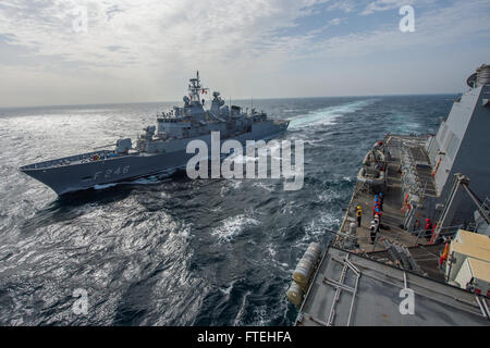 BLACK SEA (Oct. 16, 2014) – The Turkish navy Barbaros-class frigate TCG Salihreis (F 246) comes alongside the Arleigh Burke-class guided-missile destroyer USS Cole (DDG 67) during a passing exercise. Cole, homeported in Norfolk, Va., is conducting naval operations in the U.S. 6th Fleet area of operations in support of U.S. national security interests in Europe. Stock Photo