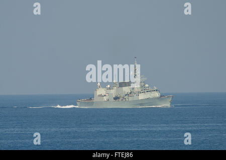 The Canadian Navy's Halifax-class frigate HMCS Toronto (FFH 333) is shown maneuvering during Exercise Mavi Balina 2014 in the Mediterranean Sea. This biennial Turkish-led anti-submarine warfare exercise, involving NATO and regional forces, aims to enhance interoperability and tactical proficiency in the region. Stock Photo
